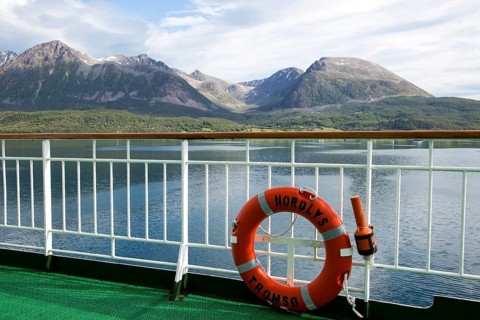 Steep mountains of Grytoya island, Troms county, northern Norway from Hurtigruten ferry ship