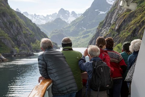 Tourists sightseeing from Hurtugruten ship, Trollfjorden, Lofoten Islands, Nordland, northern,