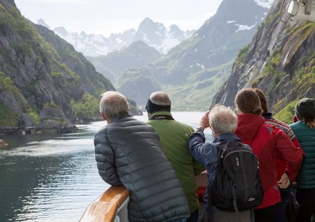 Tourists sightseeing from Hurtugruten ship, Trollfjorden, Lofoten Islands, Nordland, northern,