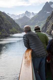 Tourists sightseeing from Hurtugruten ship, Trollfjorden, Lofoten Islands, Nordland, northern,