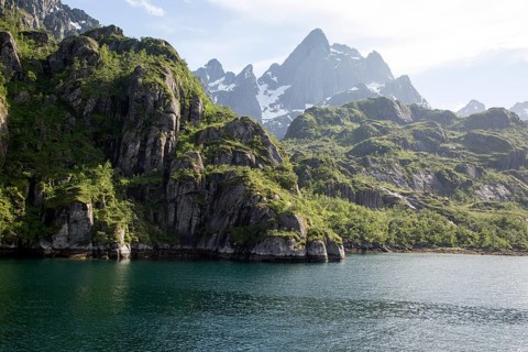 Steep sided glacial trough fiord jagged mountain peaks, Trollfjorden, Lofoten Islands, Nordland,