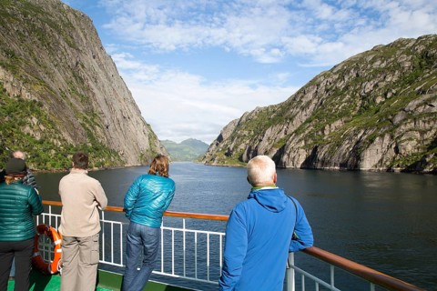 Tourists sightseeing from Hurtugruten ship, Trollfjorden, Lofoten Islands, Nordland, northern,