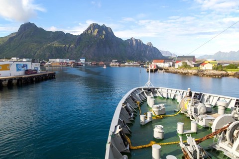 Hurtigruten ferry ship arriving at harbour at Svolvaer, Lofoten Islands, Nordland, Norway, Europe