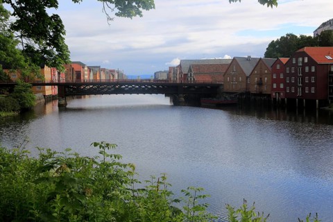 Historic waterside warehouse buildings on River Nidelva, Bryggene, Trondheim, Norway, Europe