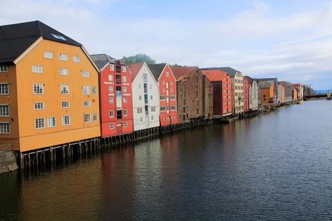 Historic waterside warehouse buildings on River Nidelva, Bryggene, Trondheim, Norway, Europe