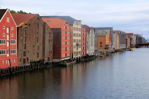Historic waterside warehouse buildings on River Nidelva, Bryggene, Trondheim, Norway, Europe