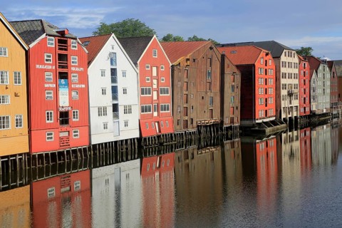 Historic waterside warehouse buildings on River Nidelva, Bryggene, Trondheim, Norway, Europe