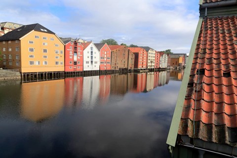 Historic waterside warehouse buildings on River Nidelva, Bryggene, Trondheim, Norway, Europe