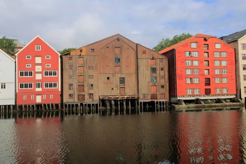 Historic waterside warehouse buildings on River Nidelva, Bryggene, Trondheim, Norway, Europe