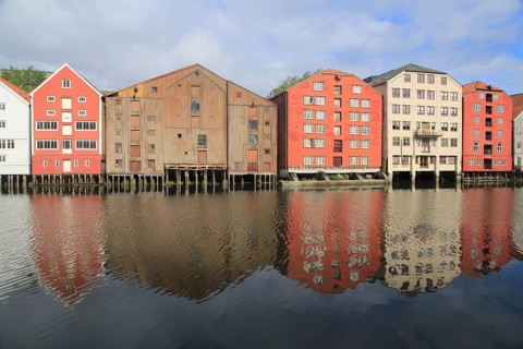 Historic waterside warehouse buildings on River Nidelva, Bryggene, Trondheim, Norway, Europe
