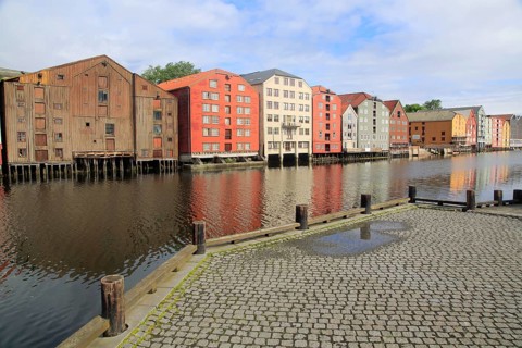 Historic waterside warehouse buildings on River Nidelva, Bryggene, Trondheim, Norway, Europe