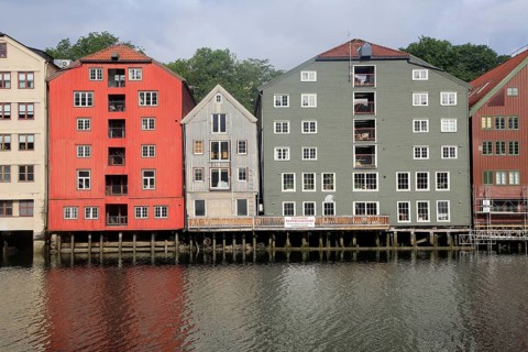 Historic waterside warehouse buildings on River Nidelva, Bryggene, Trondheim, Norway, Europe