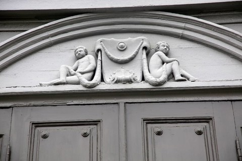 Details of cherub carvings, Stiftsgarden palace in city of Trondheim, Norway, Europe