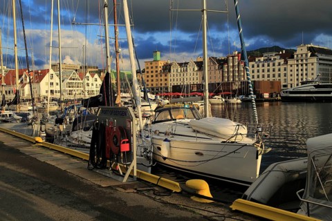 Sailing yachts and historic buildings evening light, Vagen harbour, Bergen, Norway, Europe