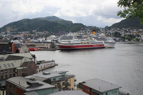 Fjordline ferry ship and cruise ship in docks, city of Bergen, Norway, Europe