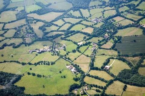 A patchwork of fields seen from the air near Gatwick airport, London, England, UK