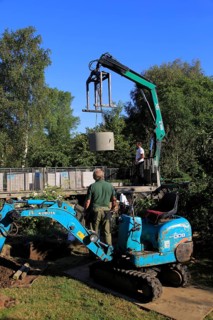 Delivery and installation of concrete ring for domestic septic tank system, Suffolk, England, UK