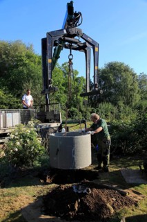 Delivery and installation of concrete ring for domestic septic tank system, Suffolk, England, UK