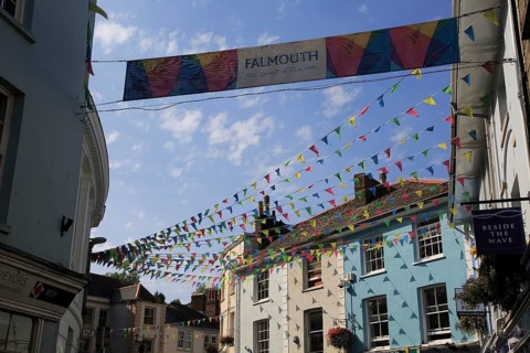 Bunting flags flying in street of town centre, Falmouth, Cornwall, England, UK