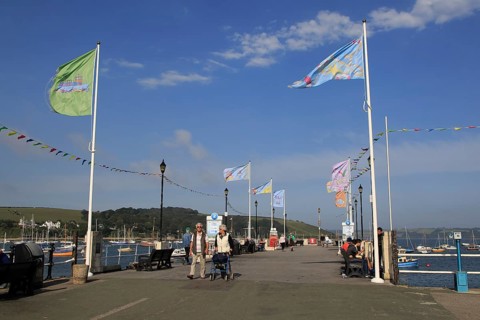 Flags flying on Prince of Wales pier, Falmouth, Cornwall, England, UK