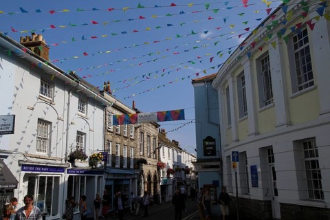 Bunting flags flying in street of town centre, Falmouth, Cornwall, England, UK