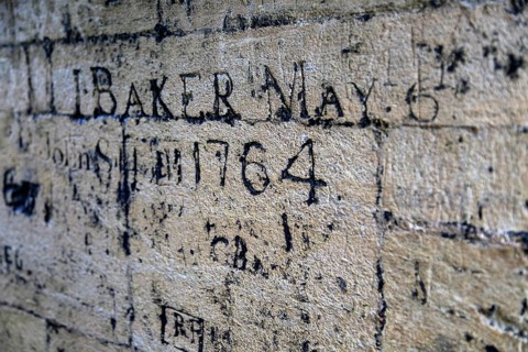 Old graffiti names carved on wall, University Church of St Mary the Virgin, Oxford, England, UK
