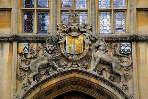 Heraldic emblems over entrance to Brasenose College building frontage University of Oxford,