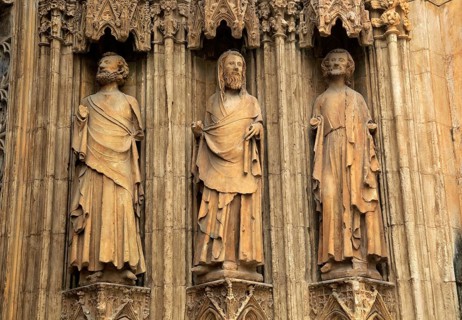 Statues of Christian saints carved stonework of the cathedral church in city of Valencia, Spain,