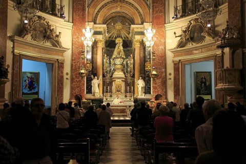 Catholic mass priest at altar in cathedral church, city of Valencia, Spain, Europe