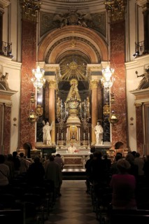 Catholic mass priest at altar in cathedral church, city of Valencia, Spain, Europe