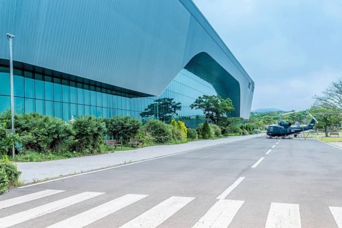 Military helicopter on road in front of aeronautics museum in Jeju, South Korea, Asia