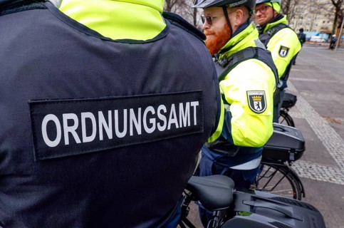 Employees of the public order office's bicycle squadron with their bikes and protective clothing.