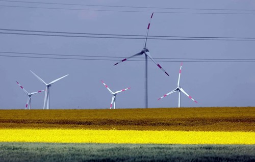 Wind farm with windmills and power lines, Nauen, 20/05/2022