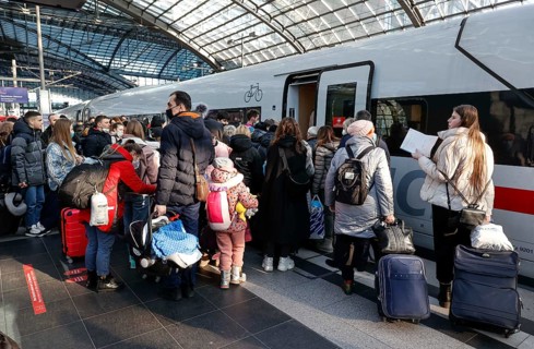 Refugees from Ukraine board a Deutsche Bahn ICE train for their onward journey at Berlin Central