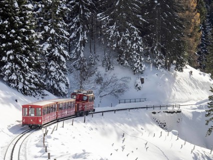 Winter landscape, Schafberg cog railway decorated for Christmas travelling up to the Schafbergalm,