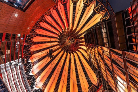 Fascinating roof construction of a building at night, illuminated and colourful, Sony Center,