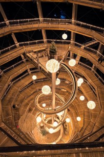 Nocturnal panoramic view of a spiral observation tower with lights, Enchanting forest dwellers,