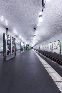 Empty underground station with white tiles and modern design under clear light, Märkisches Museum,