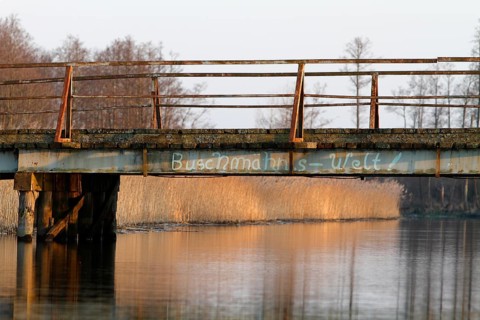 Dilapidated infrastructure on the River Trebel, old dilapidated bridge over the River Trebel,