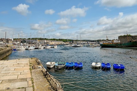 Row of small boats in the harbour basin, Concarneau, Finistère, Brittany, France, Europe