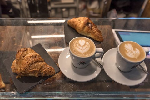 Two cappuccinos and two croissants in a café, Genoa, Italy, Europe
