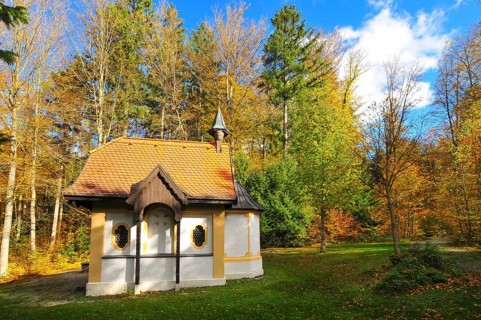 Hubertus Chapel in autumn-coloured forest near Oberschönenfeld in the Augsburg Western Forests