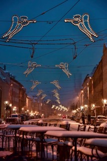 The snow-covered Maximilianstraße with Christmas lights in Augsburg, Swabia, Bavaria, Germany,