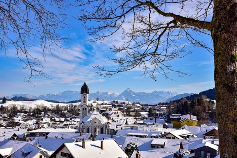 View of the Allgäu municipality of Nesselwang with the church of St Andrew, in the background the