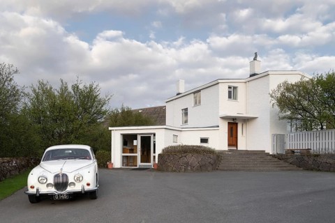 Jaguar and house of Nobel Prize winner Halldor Laxness, Gljúfrasteinn-Laxness Museum,
