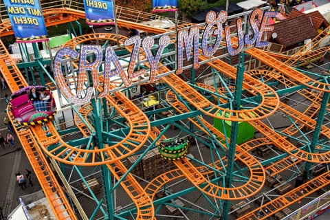 Roller coaster Crazy Mouse, rails, winding tracks of the railway, ride at fairground Kalter Markt,