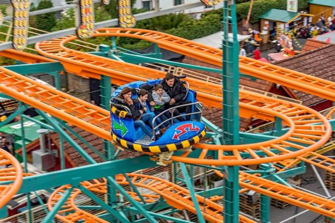 Roller coaster Crazy Mouse, winding tracks and carriages of the railway, rails, fairground ride at