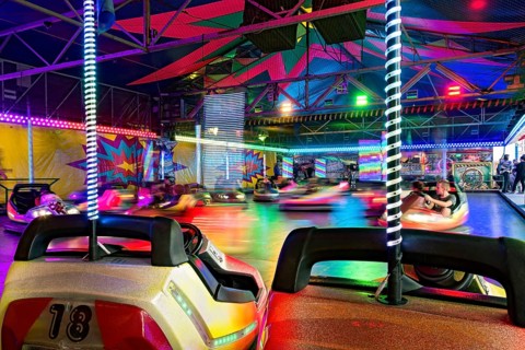 Autoscooter speedway, autodrome, bumper cars, electric cars with colourful lighting, fairground