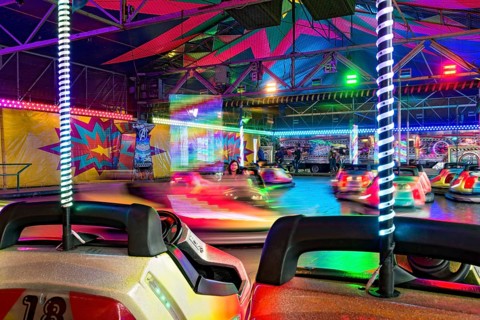 Autoscooter speedway, autodrome, bumper cars, electric cars with colourful lighting, fairground