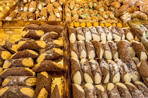 Various cannoli, sweet pastries, pastry rolls filled with cream, Italian speciality from Sicily,